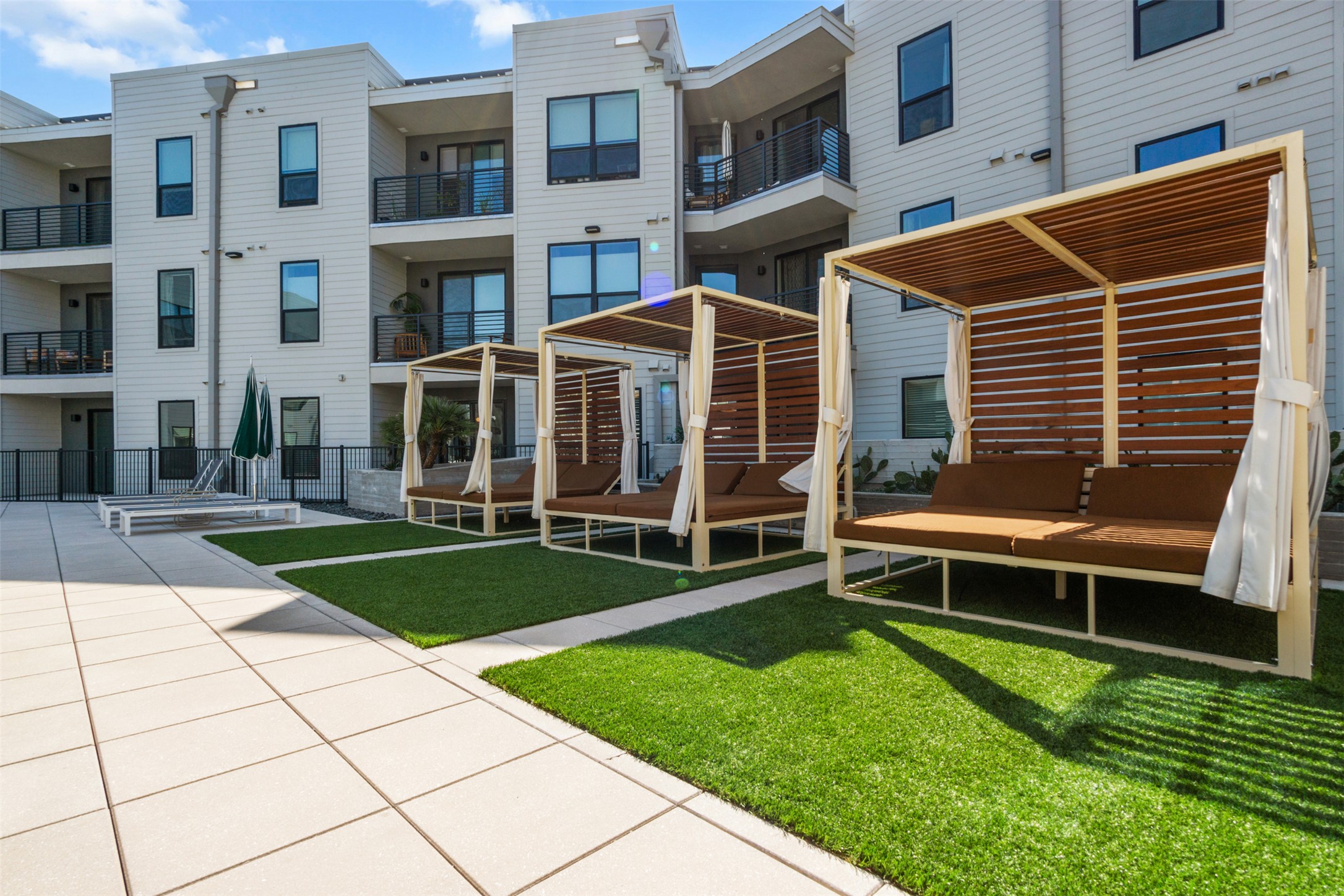 1701 Simond Avenue, Unit 418 Austin, TX 78723 - Photo 24 of 37 Cabanas by the pool.
