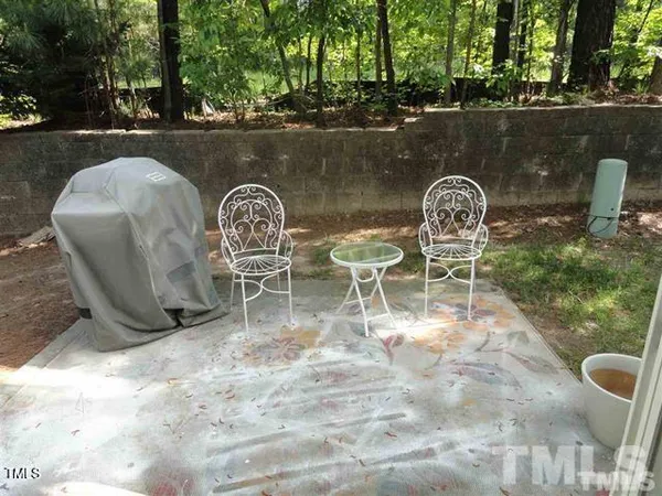 an outdoor sitting area with furniture