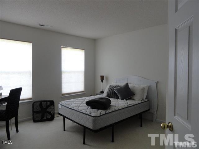 308 Durston Loop Morrisville, NC 27560 - Photo 4 of 13 a living room with furniture and a rug