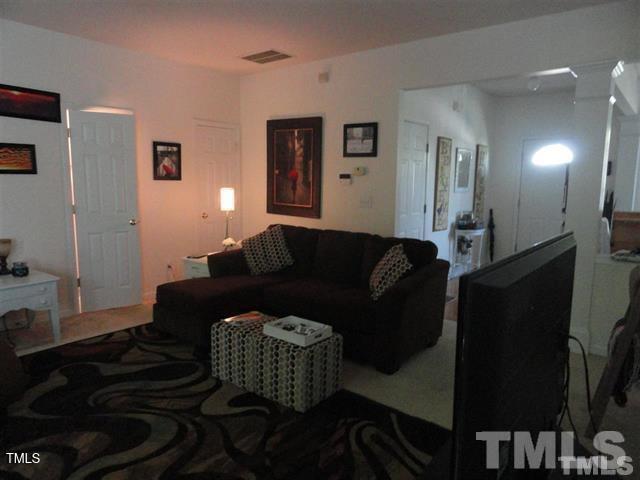 308 Durston Loop Morrisville, NC 27560 - Photo 9 of 13 a living room with furniture and a lamp