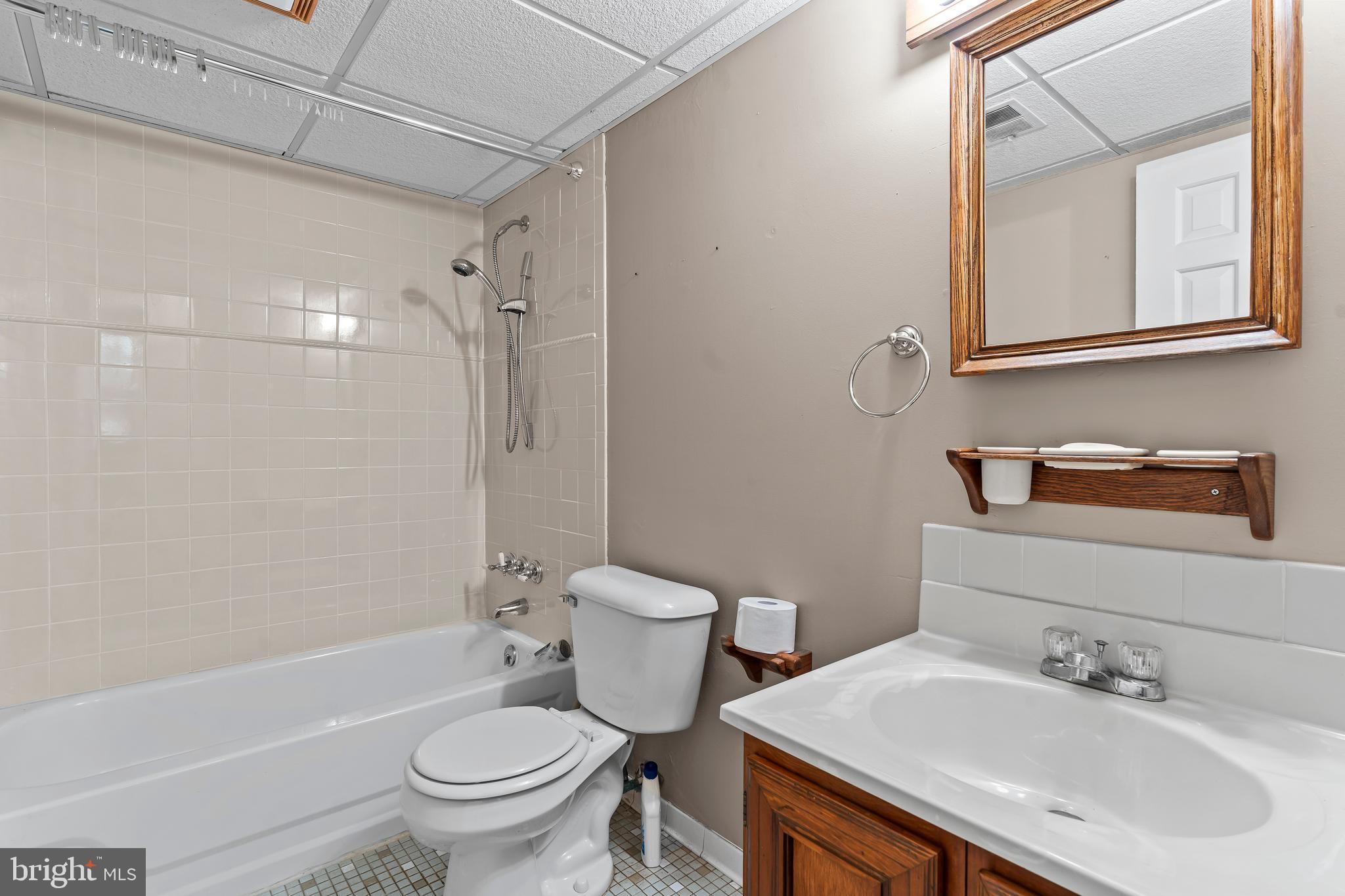 7705 Ridge Road Frederick, MD 21702 - Photo 33 of 51 a bathroom with a sink toilet and shower