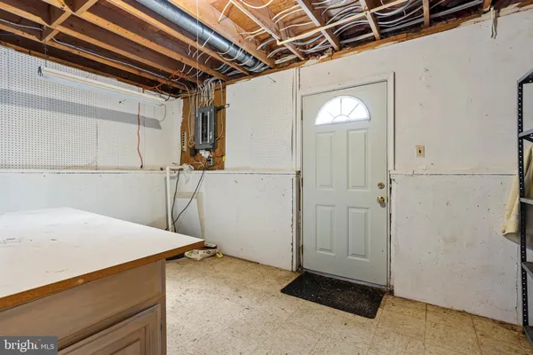 a utility room with sink dryer and washer