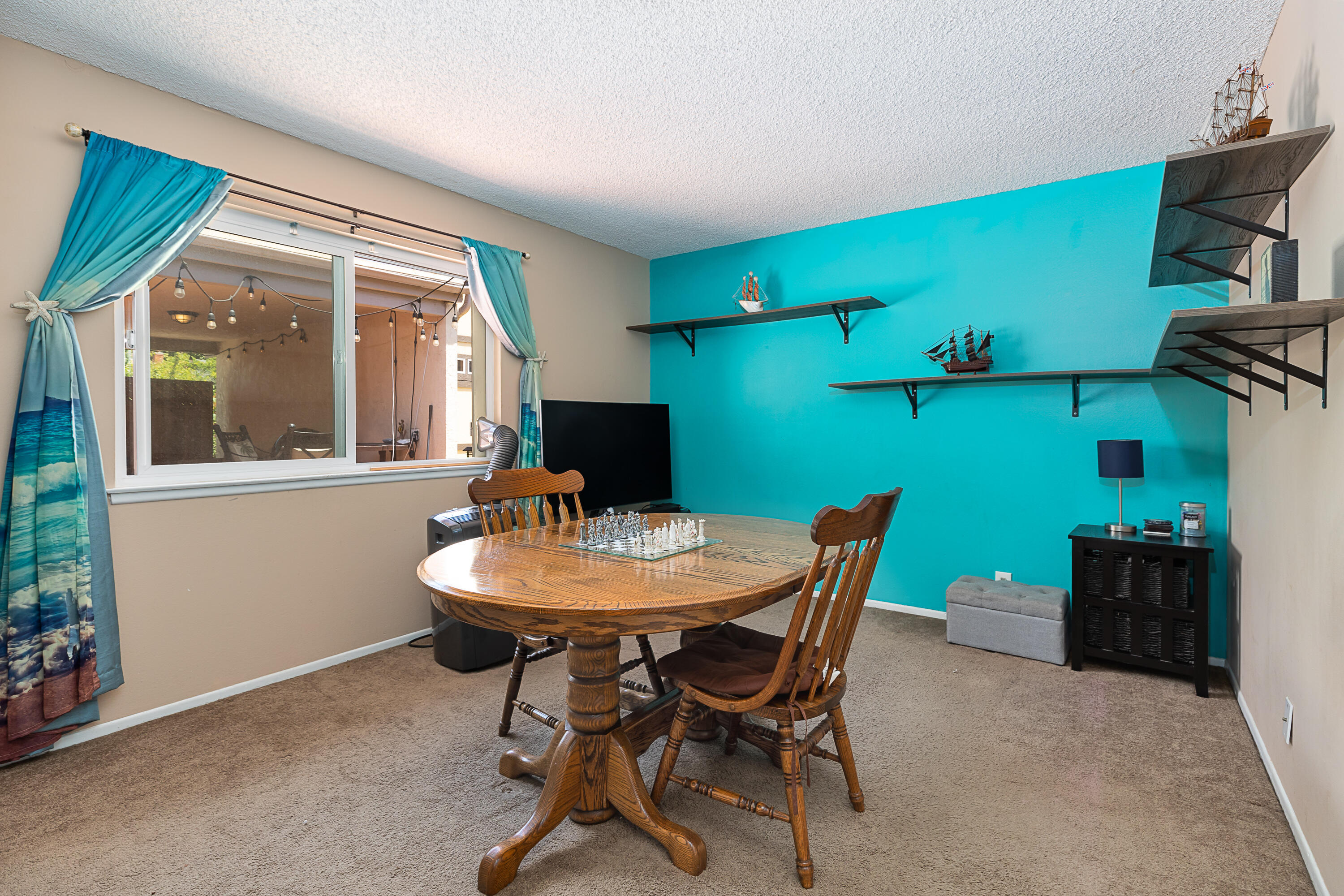 224 Hillview Drive Goleta, CA 93117 - Photo 15 of 20 a view of a dining room with furniture and a potted plant