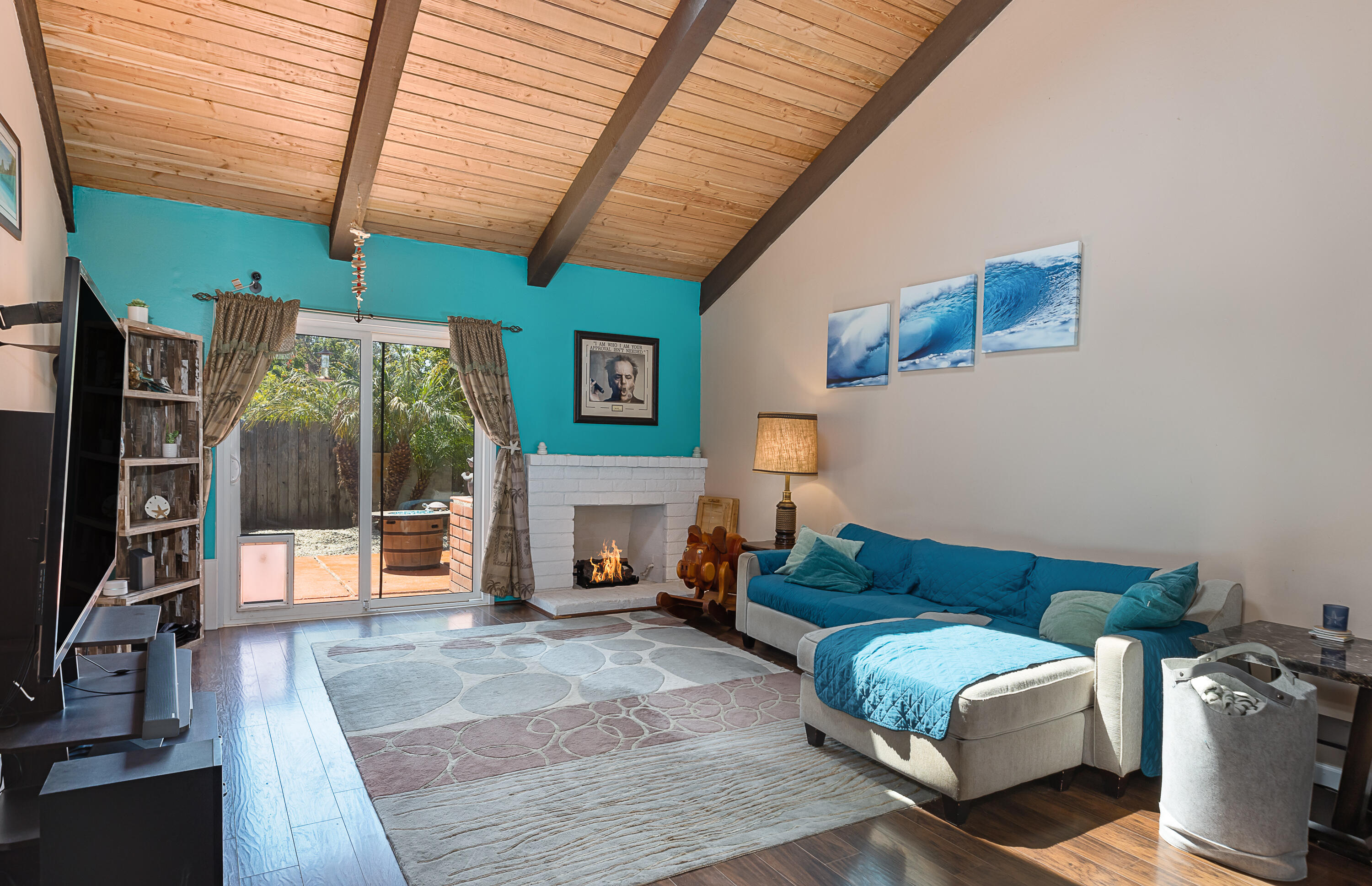 224 Hillview Drive Goleta, CA 93117 - Photo 3 of 20 a living room with furniture a flat screen tv and a table