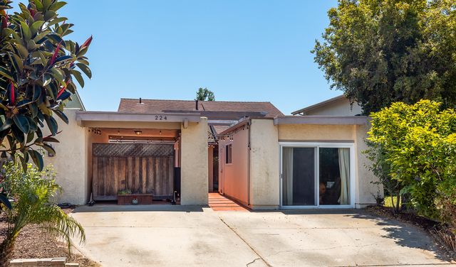 a front view of a house with yard
