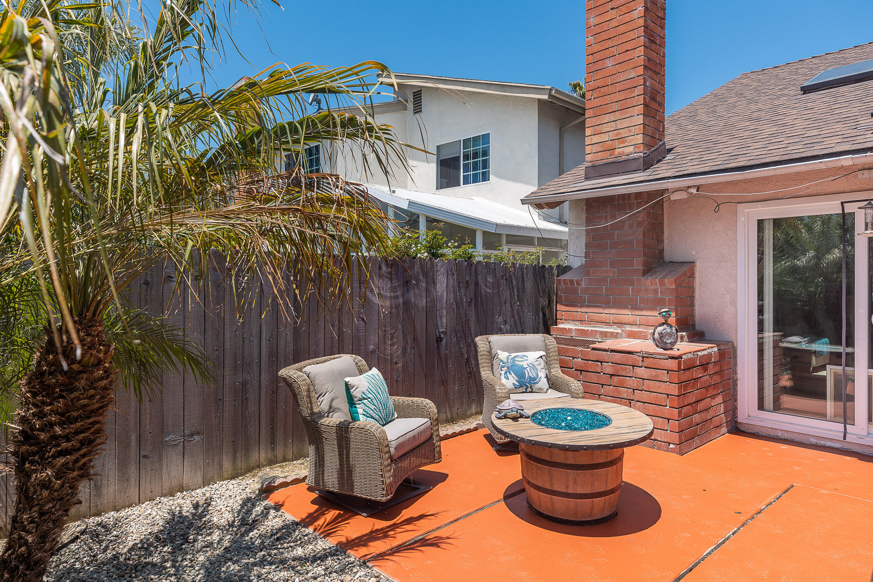 224 Hillview Drive Goleta, CA 93117 - Photo 8 of 20 a view of a patio with table and chairs potted plants and wooden fence