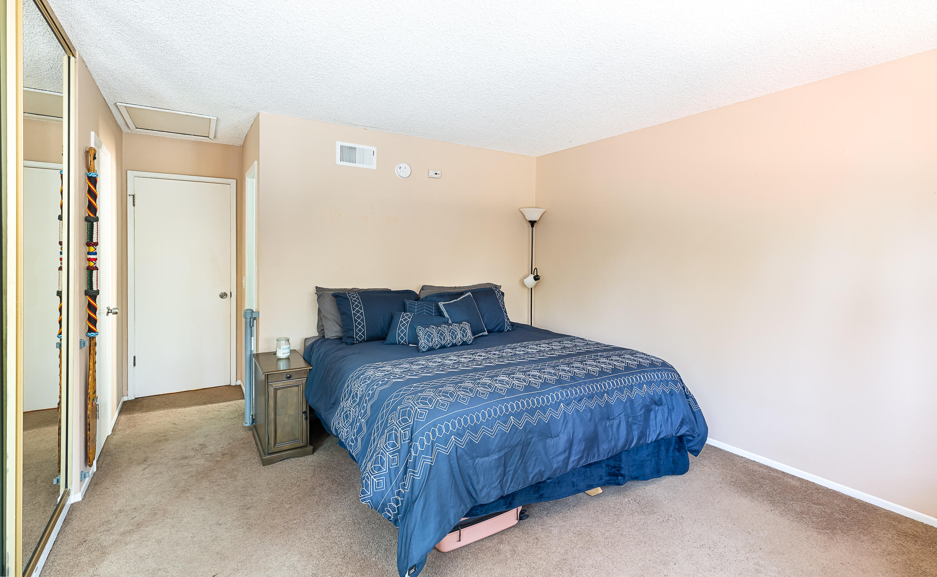 224 Hillview Drive Goleta, CA 93117 - Photo 9 of 20 a bedroom with a bed and a night stand
