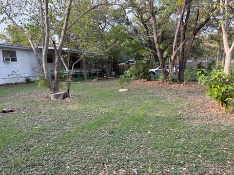 7802 Persimmon Trail Austin, TX 78745 - Photo 3 of 7 a backyard of a house with entertaining space