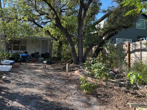 7802 Persimmon Trail Austin, TX 78745 - Photo 7 of 7 a backyard of a house with seating space