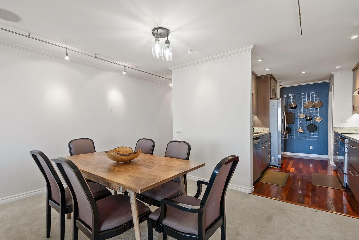 320 Vallejo Drive, Unit 41 Millbrae, CA 94030 - Photo 12 of 37 a view of a dining room with furniture and wooden floor