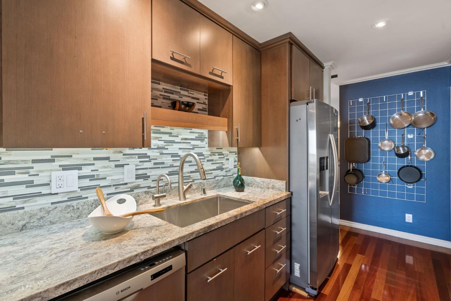 320 Vallejo Drive, Unit 41 Millbrae, CA 94030 - Photo 14 of 37 a bathroom with a granite countertop sink and a mirror