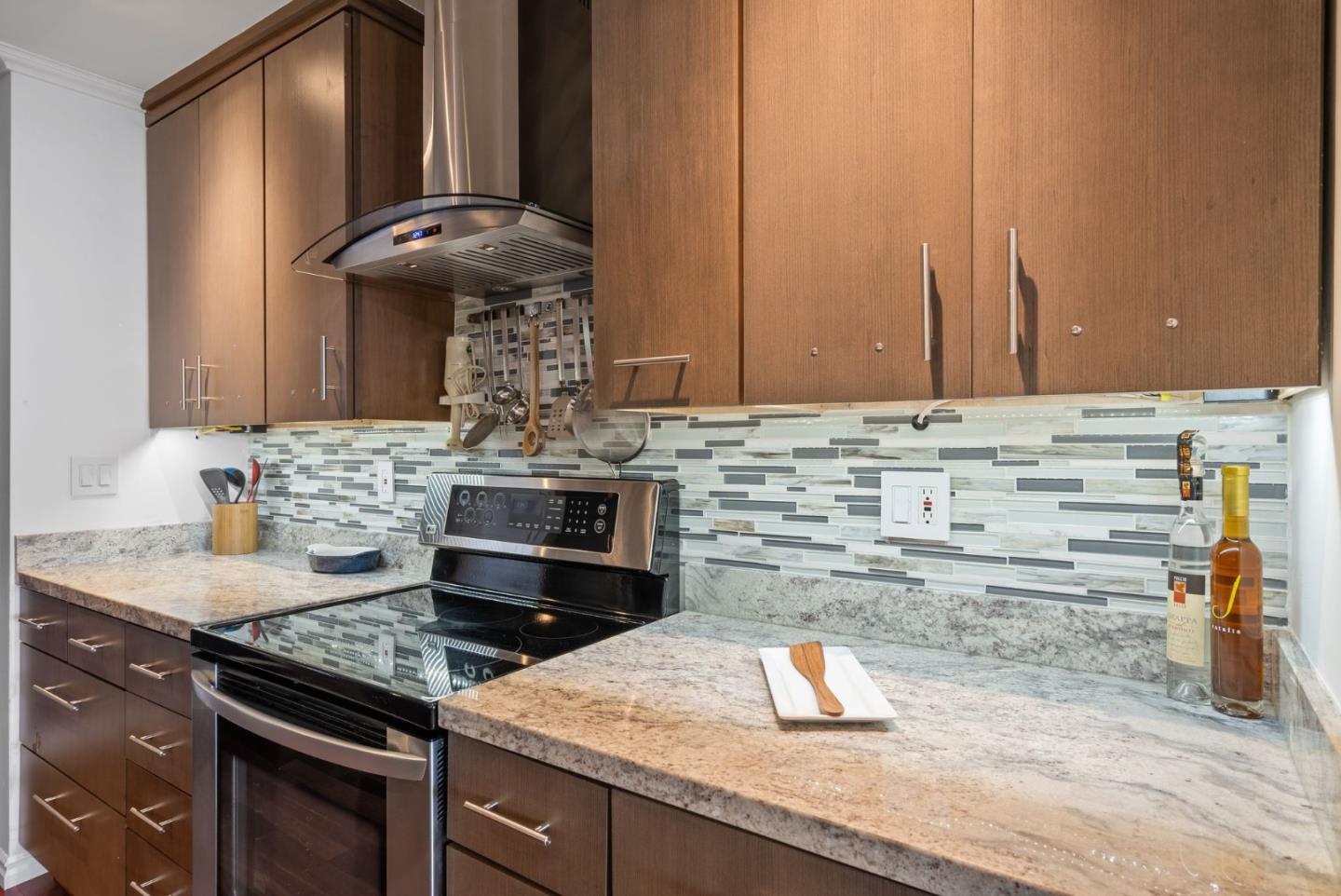 320 Vallejo Drive, Unit 41 Millbrae, CA 94030 - Photo 15 of 37 a kitchen with granite countertop a stove and a sink