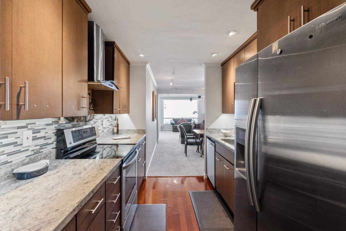320 Vallejo Drive, Unit 41 Millbrae, CA 94030 - Photo 16 of 37 a kitchen with stainless steel appliances granite countertop a sink stove and refrigerator