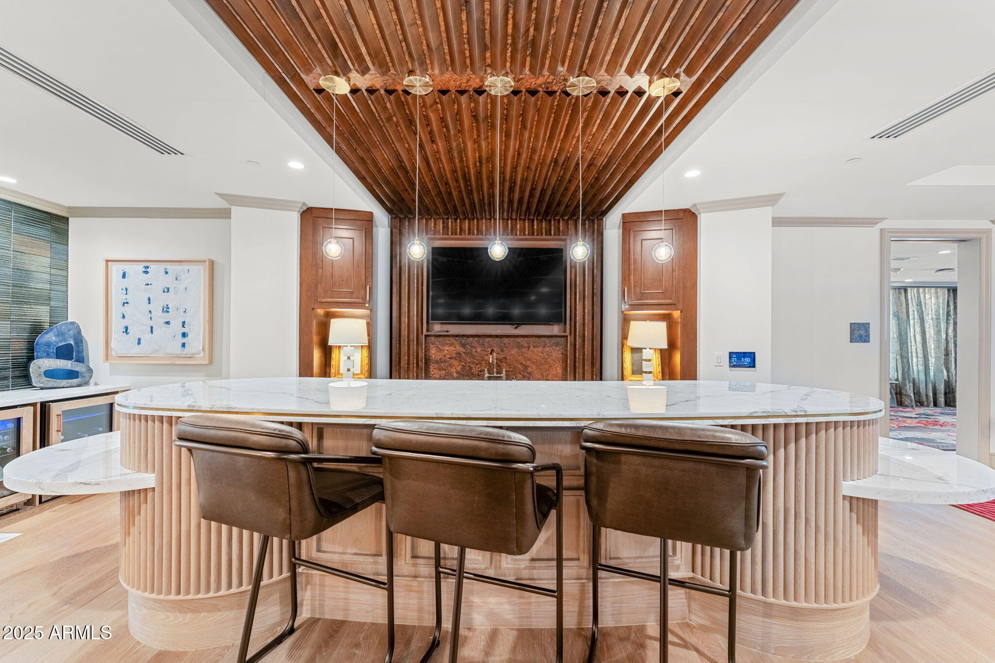 4240 East Camelback Road, Unit 304 Phoenix, AZ 85018 - Photo 5 of 12 a kitchen with a table chairs sink and cabinets