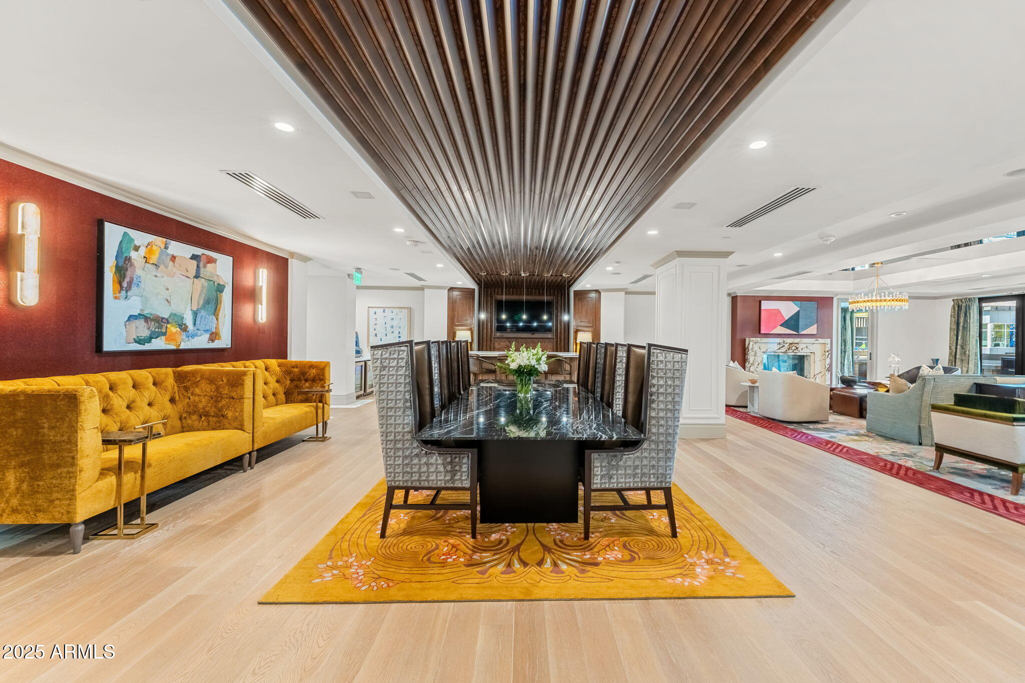 4240 East Camelback Road, Unit 304 Phoenix, AZ 85018 - Photo 6 of 12 a living room with furniture a large window and kitchen view