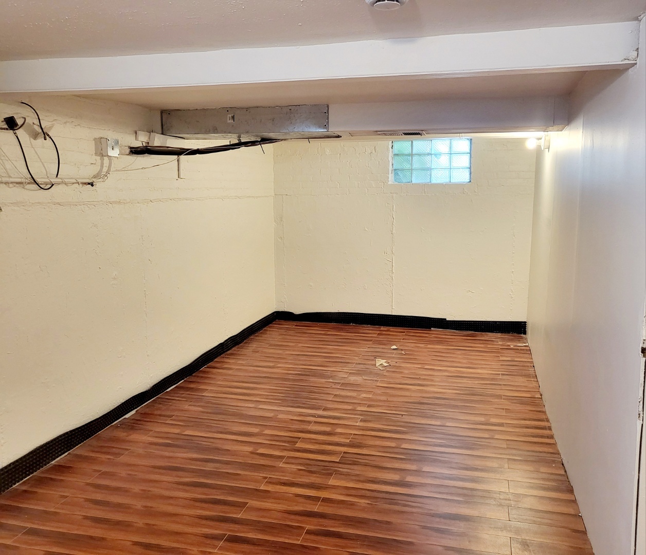 15041 Cottage Grove Avenue Dolton, IL 60419 - Photo 8 of 11 a view of an empty room with wooden floor and entryway