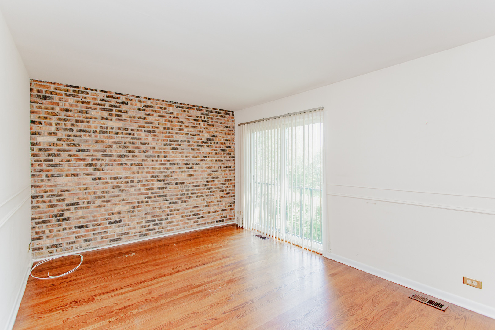 590 Green Bay Road Glencoe, IL 60022 - Photo 11 of 33 a view of empty room with wooden floor and fan