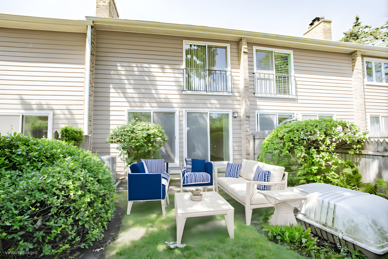 590 Green Bay Road Glencoe, IL 60022 - Photo 21 of 33 a view of a house with backyard sitting area and garden