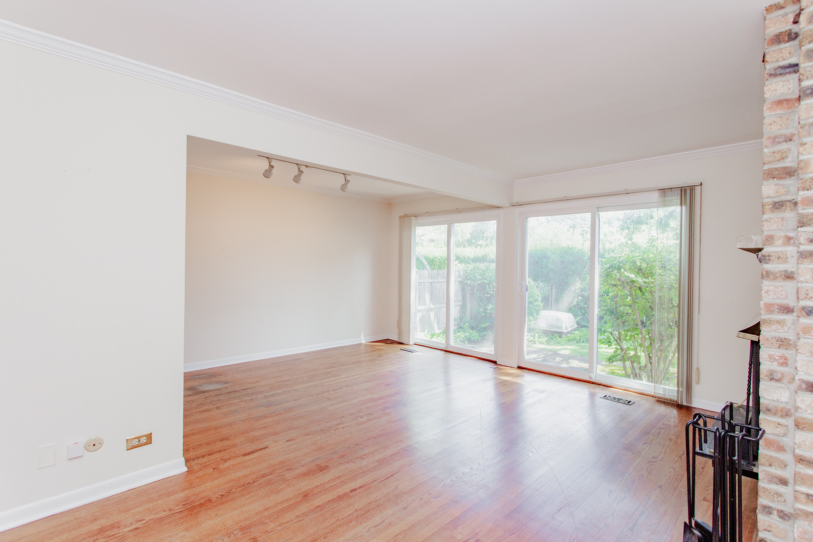 590 Green Bay Road Glencoe, IL 60022 - Photo 8 of 33 a view of an empty room with wooden floor and a window
