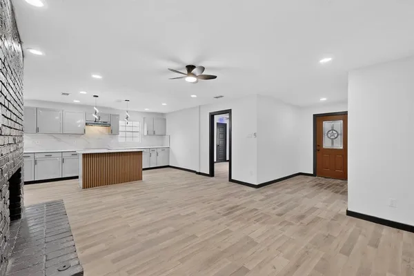 a view of kitchen with wooden floor