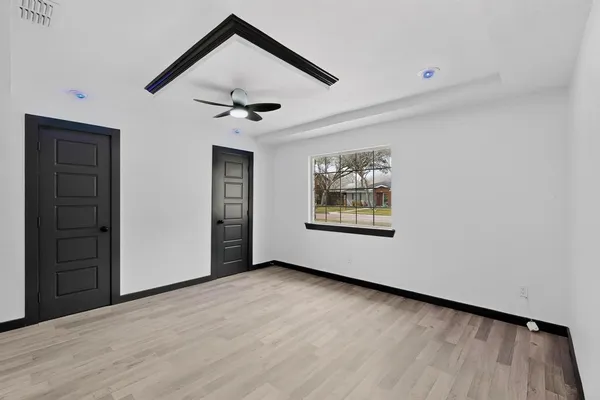 a view of an empty room with a window