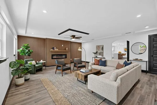 a living room with furniture and a large window