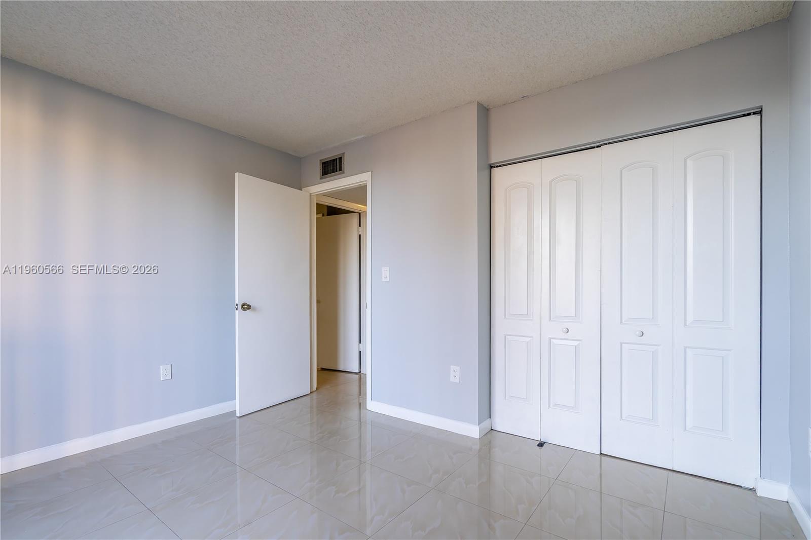 6795 Southwest 132nd Avenue, Unit 101 Miami, FL 33183 - Photo 11 of 37 a view of an empty room