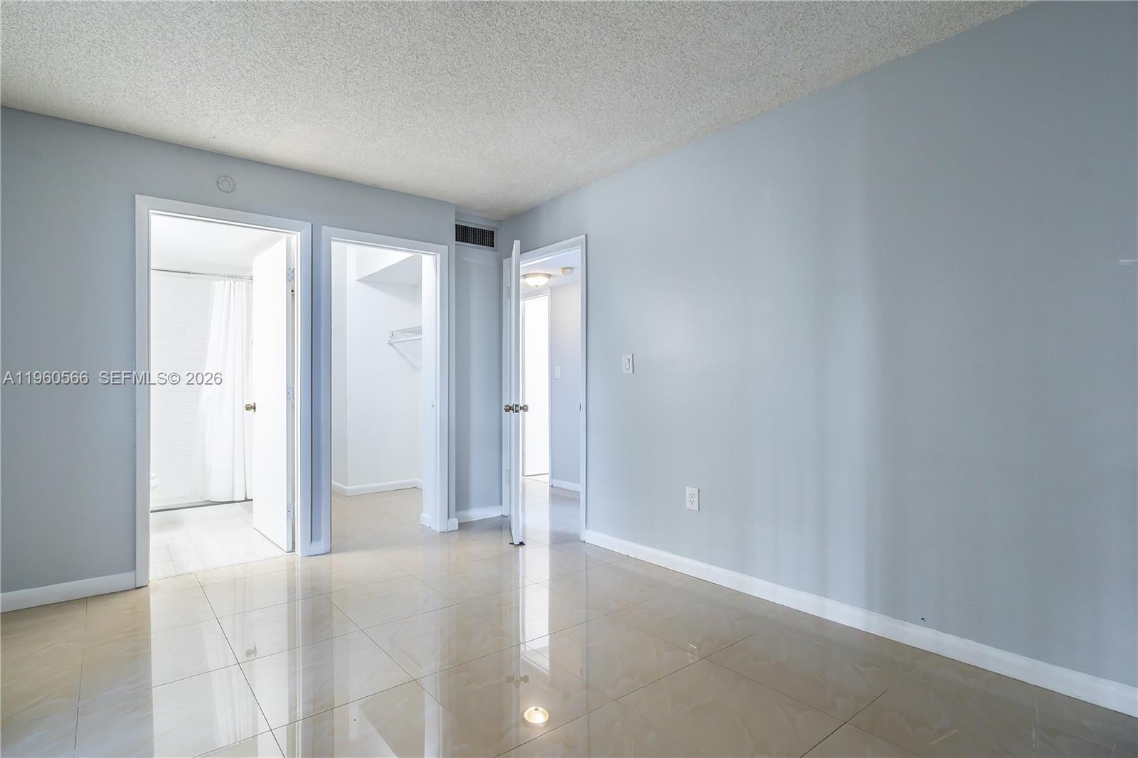 6795 Southwest 132nd Avenue, Unit 101 Miami, FL 33183 - Photo 21 of 37 a view of an empty room