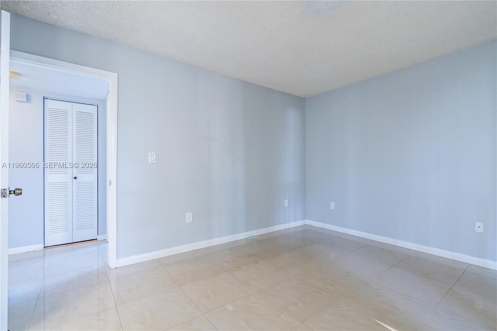6795 Southwest 132nd Avenue, Unit 101 Miami, FL 33183 - Photo 22 of 37 a view of an empty room