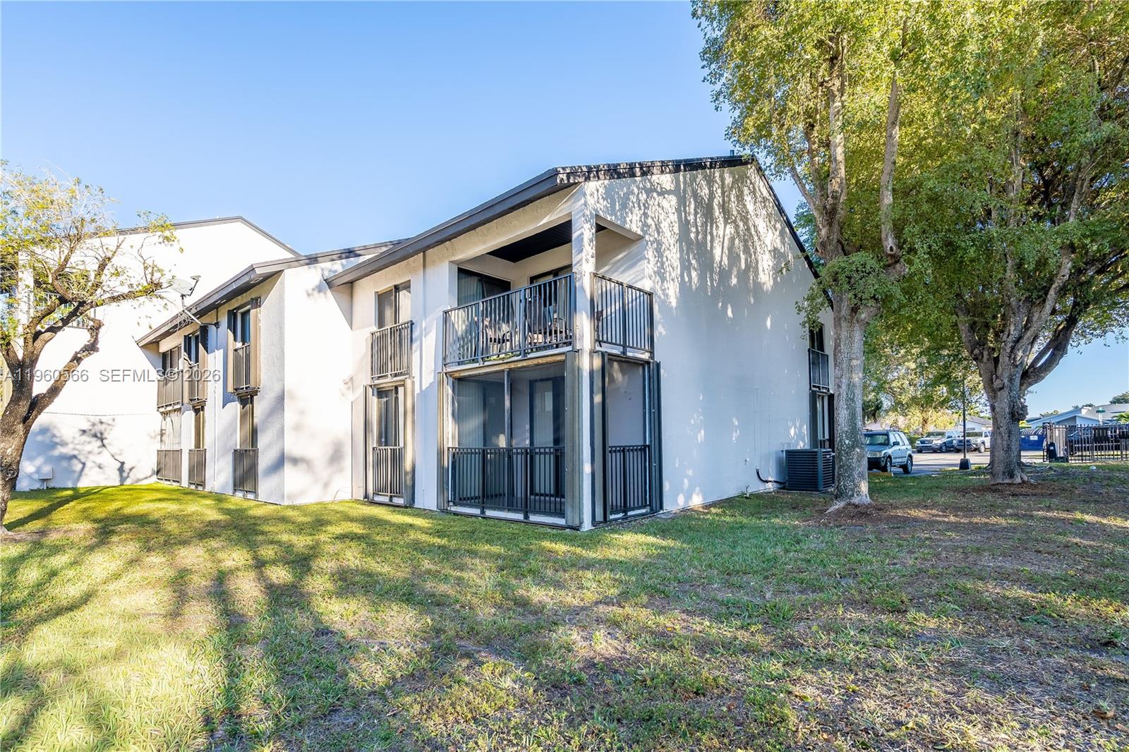 6795 Southwest 132nd Avenue, Unit 101 Miami, FL 33183 - Photo 3 of 37 a view of a house with a yard