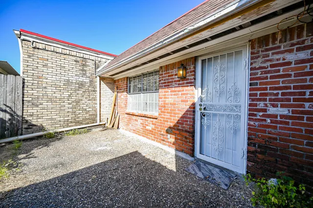 a view of backyard with a door