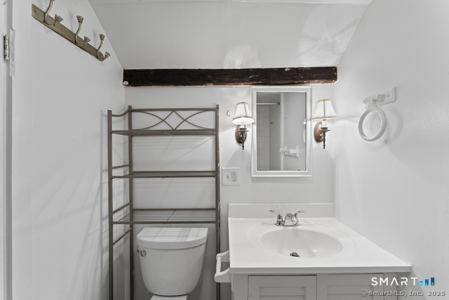 3 Riverside Road, Unit B Newtown, CT 06482 - Photo 13 of 20 a bathroom with a sink a toilet and a mirror