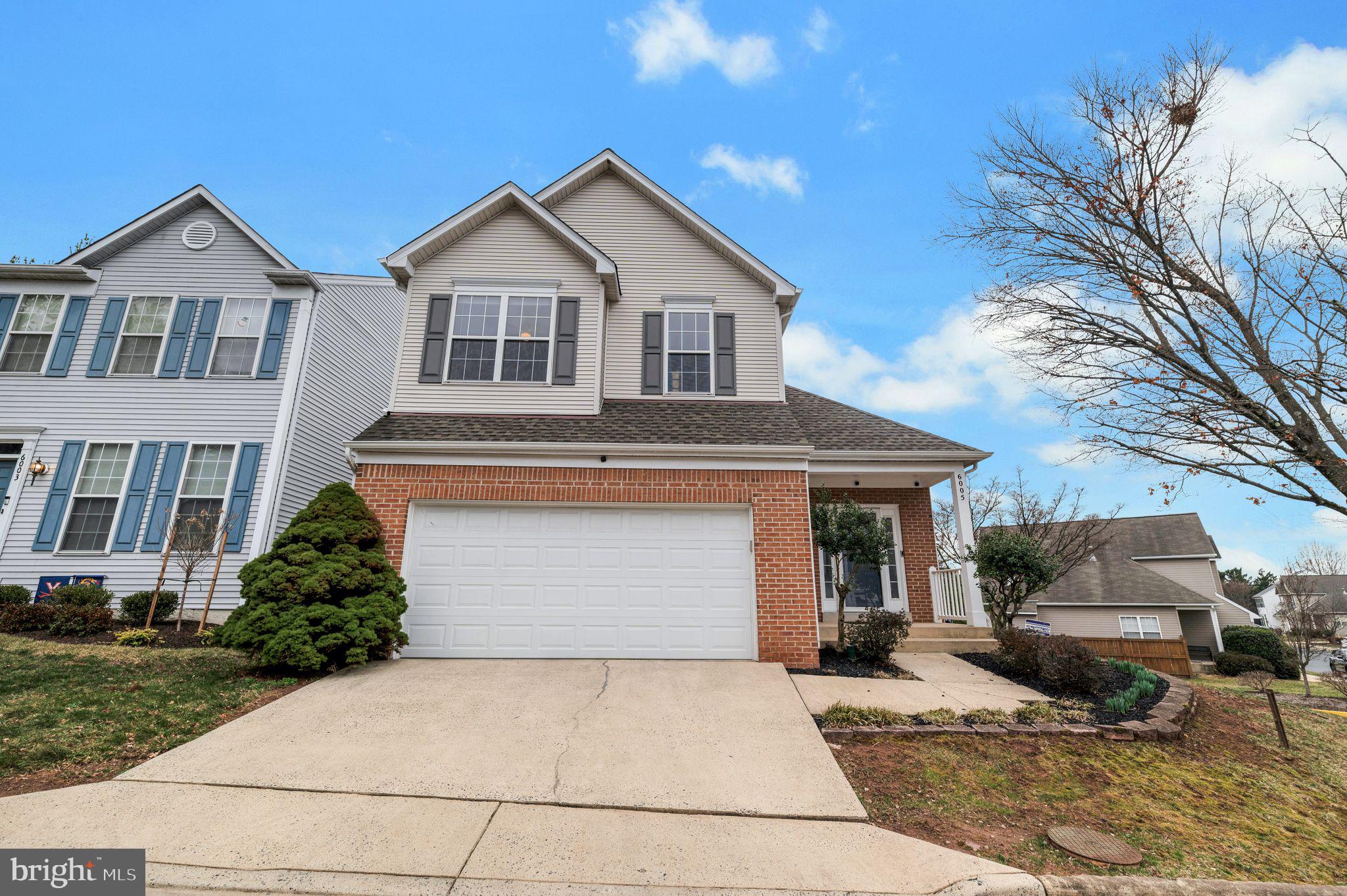 6005 Honnicut Drive Centreville, VA 20121 - Photo 1 of 29 a front view of a house with garden