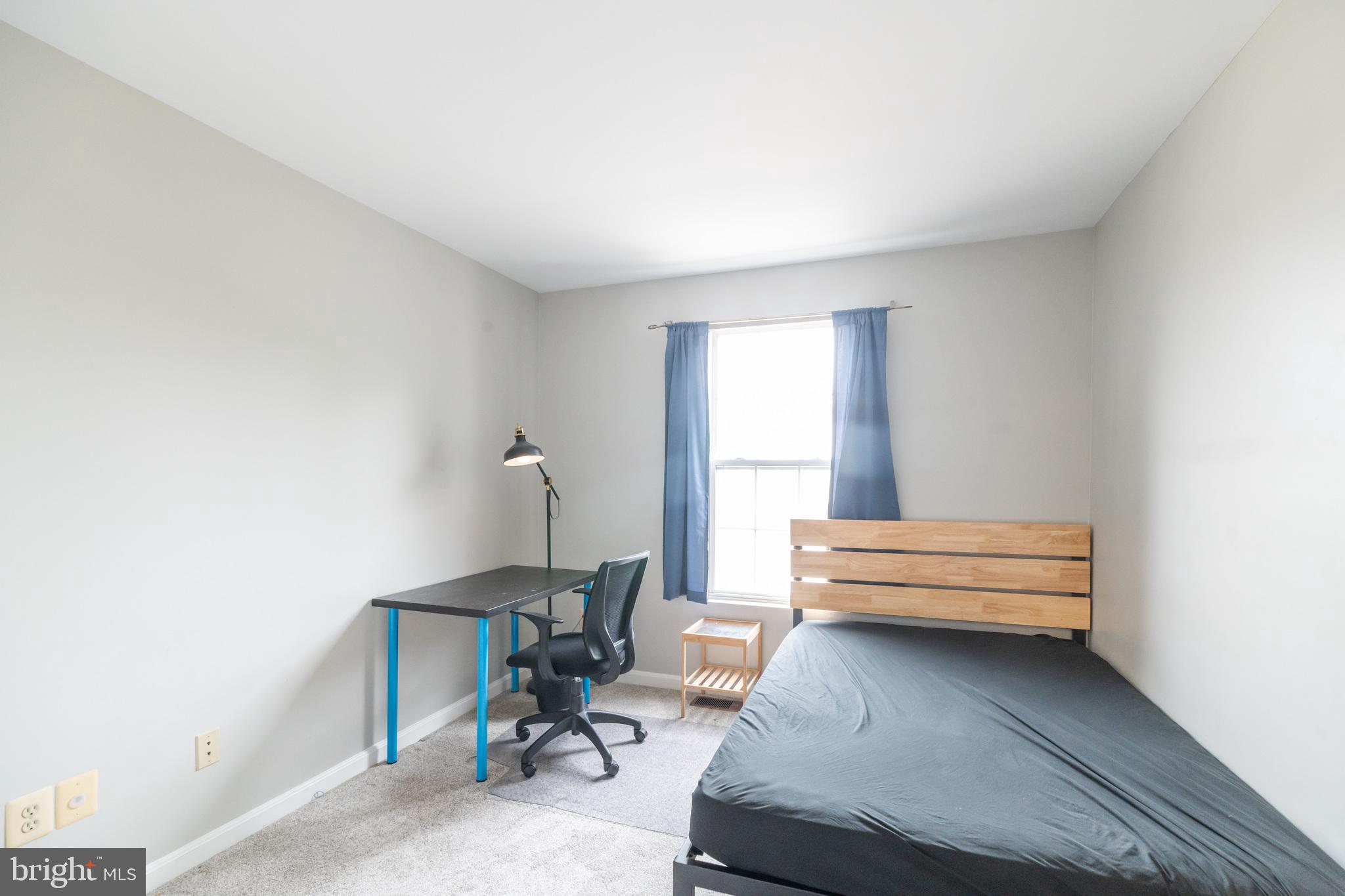6005 Honnicut Drive Centreville, VA 20121 - Photo 19 of 29 a bedroom with a bed and a window