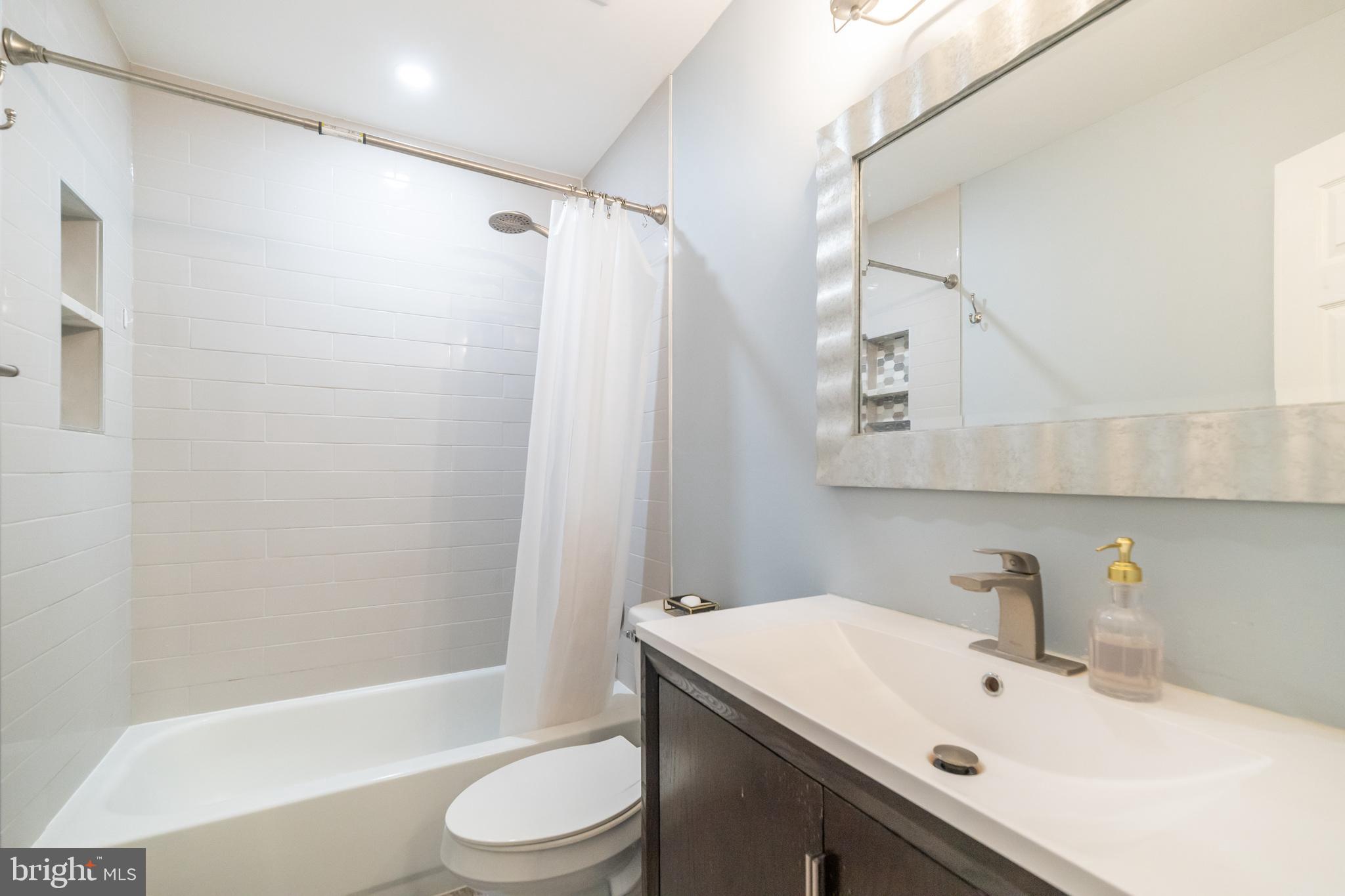6005 Honnicut Drive Centreville, VA 20121 - Photo 21 of 29 a bathroom with a sink toilet and shower