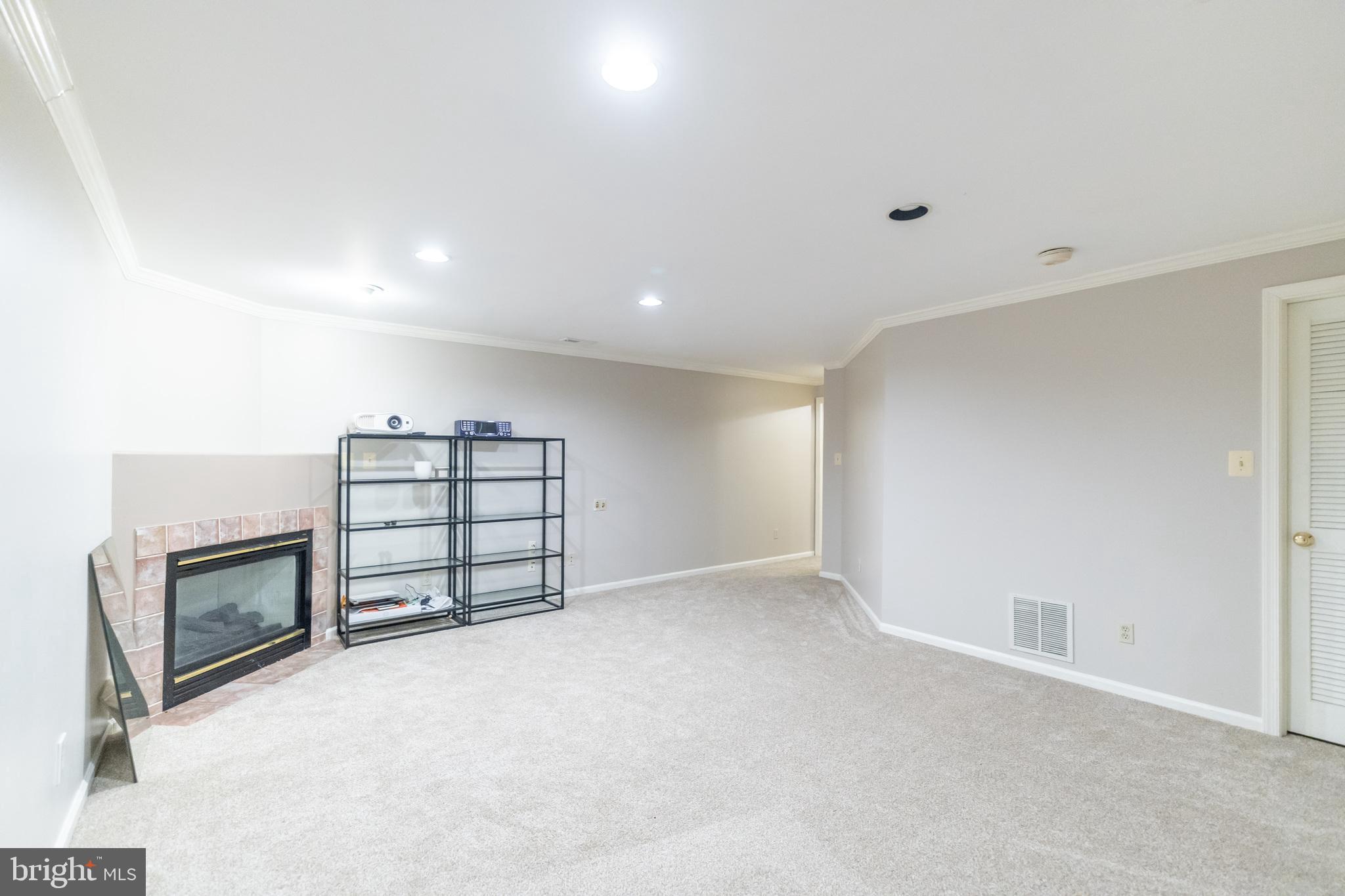 6005 Honnicut Drive Centreville, VA 20121 - Photo 22 of 29 a view of an empty room with a fireplace