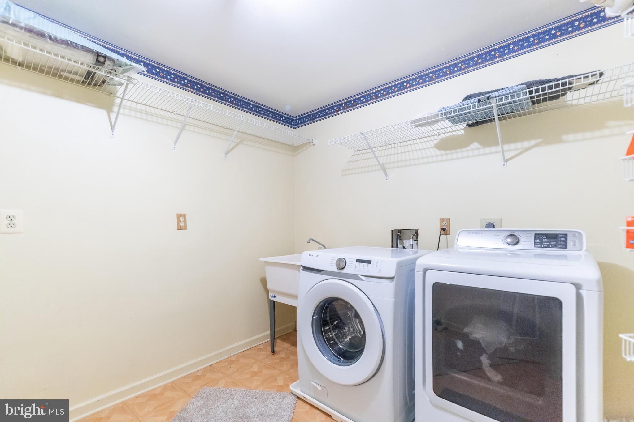 6005 Honnicut Drive Centreville, VA 20121 - Photo 23 of 29 a utility room with dryer and washer