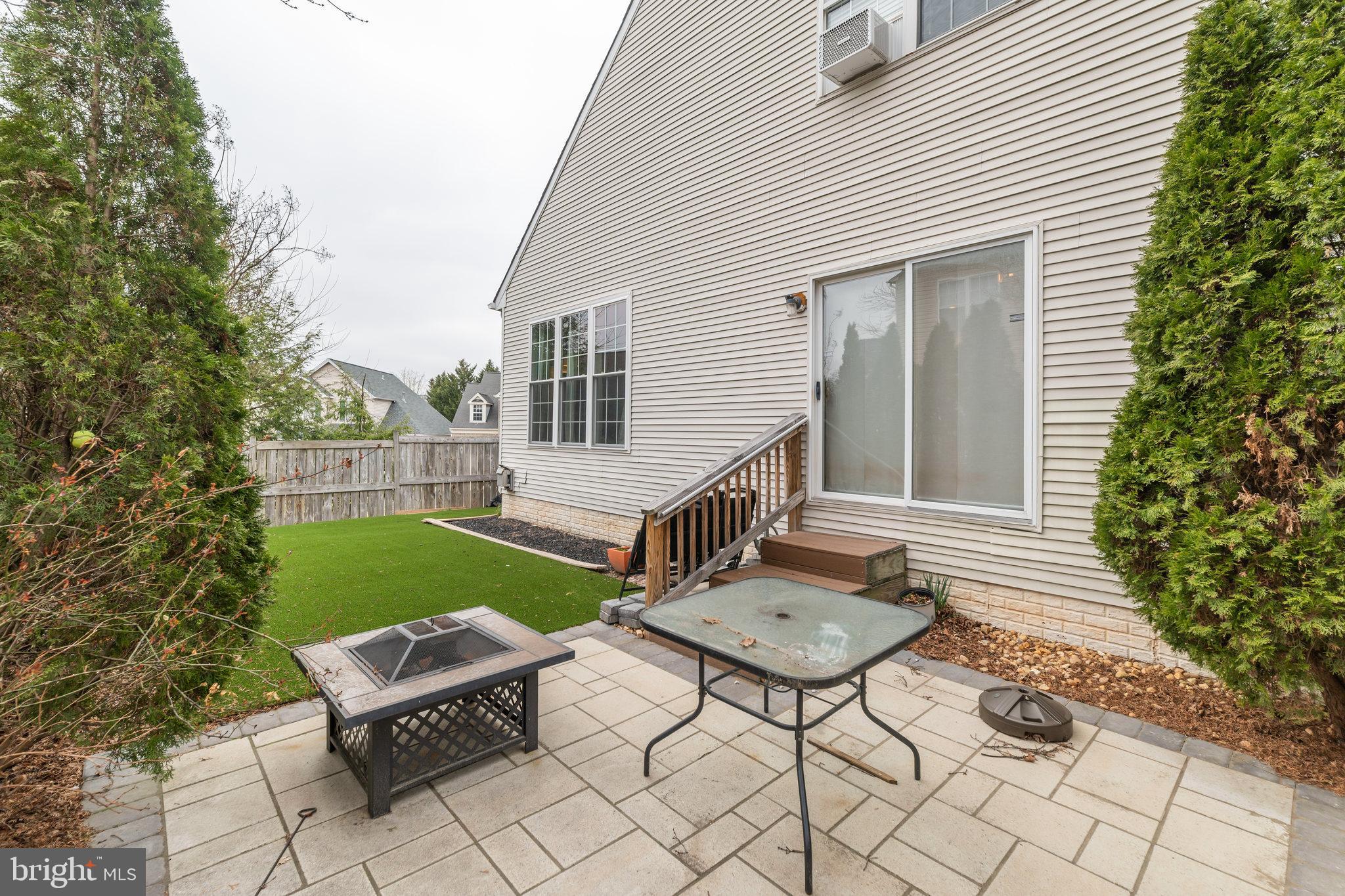 6005 Honnicut Drive Centreville, VA 20121 - Photo 26 of 29 a view of a chairs and table in backyard of the house