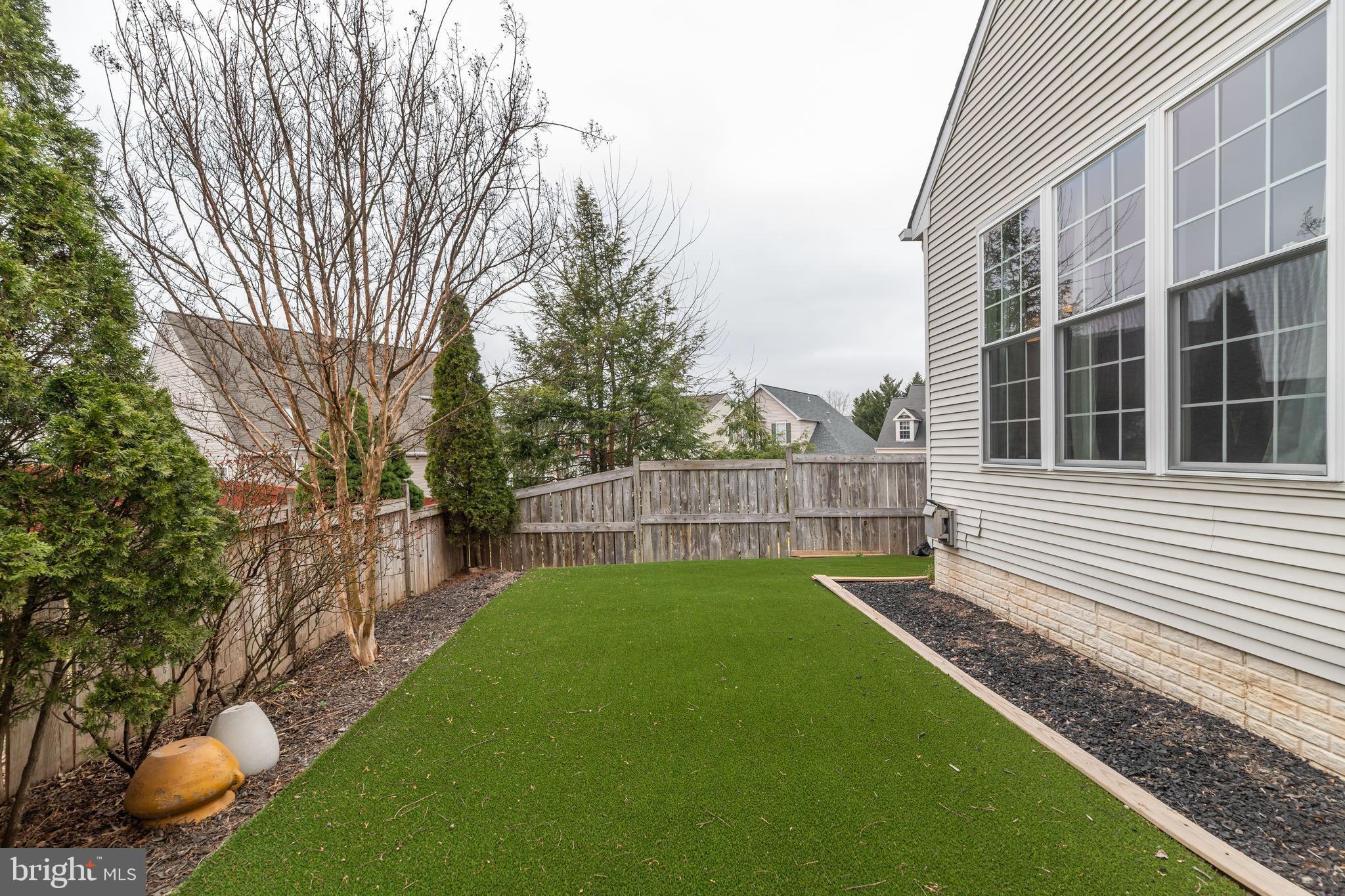 6005 Honnicut Drive Centreville, VA 20121 - Photo 27 of 29 a view of an house with backyard and a tree