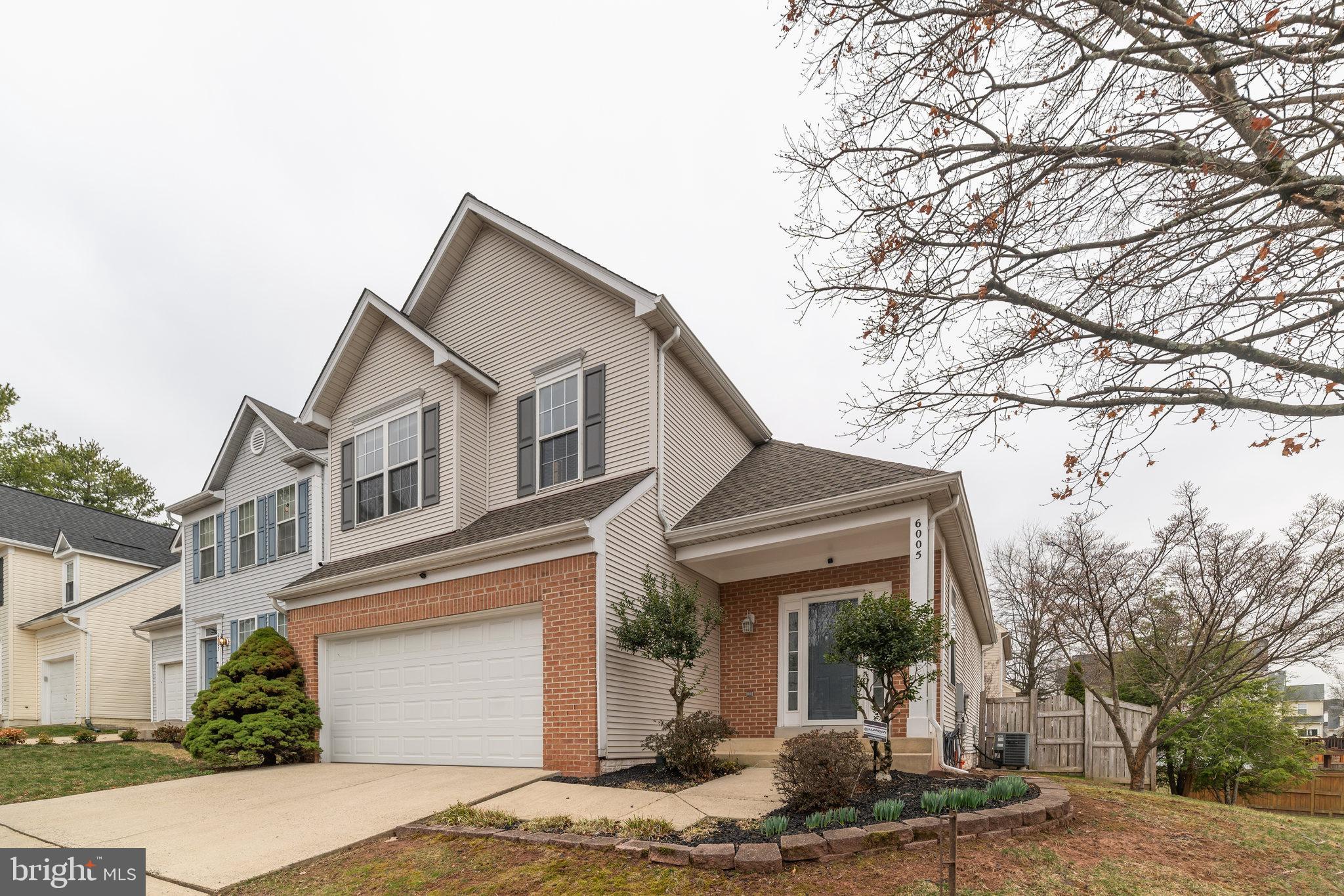 6005 Honnicut Drive Centreville, VA 20121 - Photo 29 of 29 a front view of a house with garden
