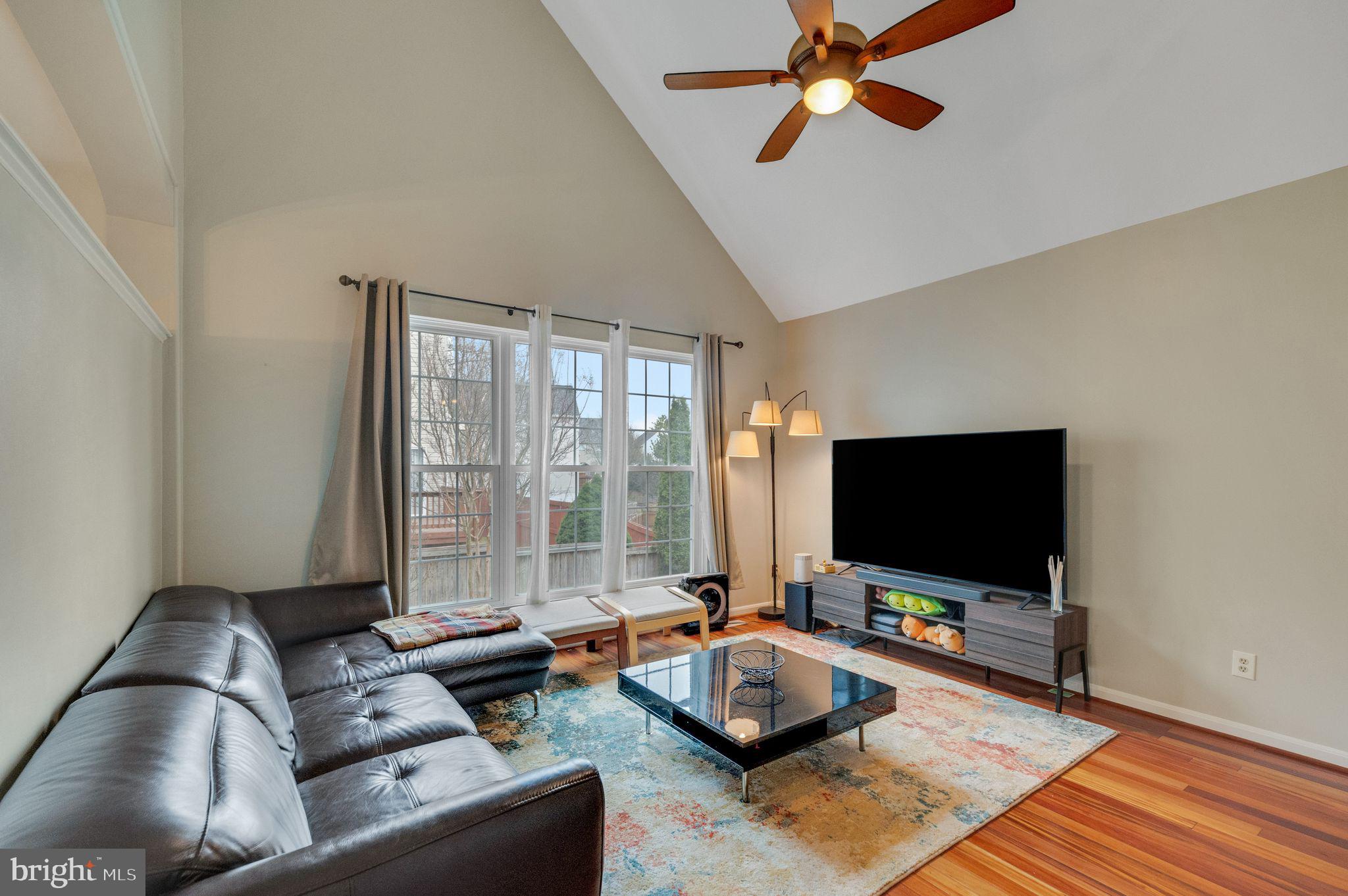 6005 Honnicut Drive Centreville, VA 20121 - Photo 10 of 29 a living room with furniture and a flat screen tv