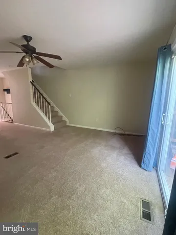 a view of a livingroom with a staircase