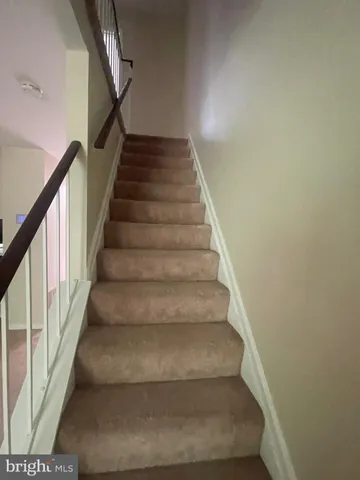 a large kitchen with a large counter top appliances and cabinets