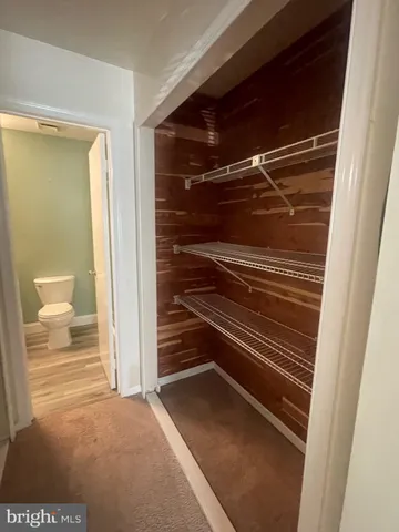 a bathroom with a sink a toilet a shower and a mirror