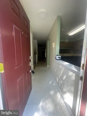 a view of a hallway with seating area
