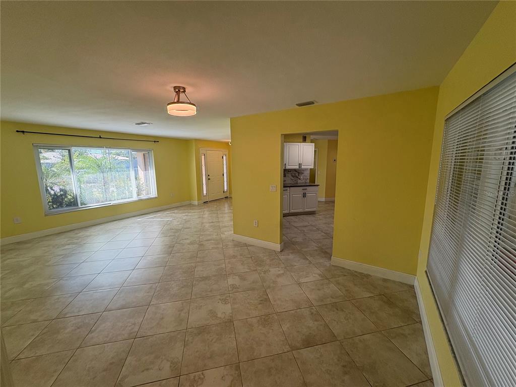 1117 Angela Maria Road Sarasota, FL 34243 - Photo 12 of 52 a view of an empty room with a window
