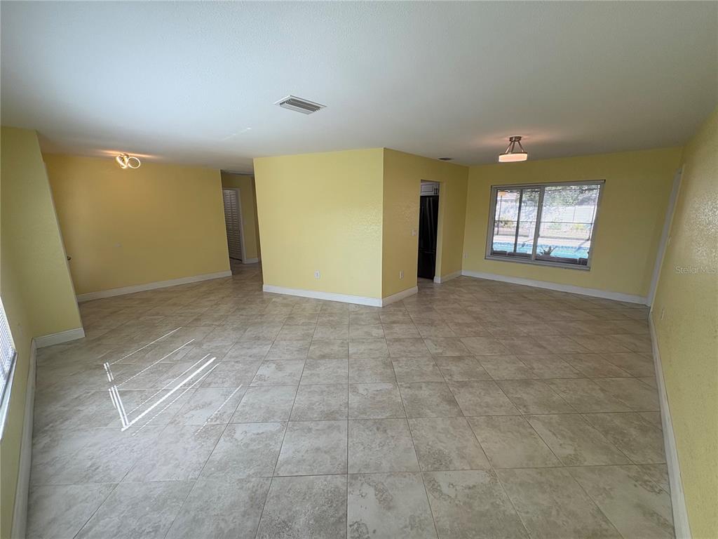 1117 Angela Maria Road Sarasota, FL 34243 - Photo 13 of 52 an empty room with windows and closet