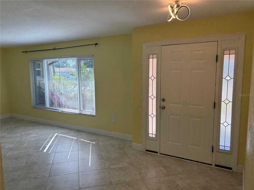 1117 Angela Maria Road Sarasota, FL 34243 - Photo 25 of 52 an empty room with windows