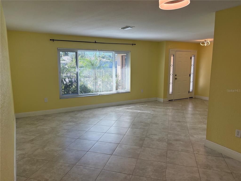 1117 Angela Maria Road Sarasota, FL 34243 - Photo 26 of 52 a view of an empty room with a window