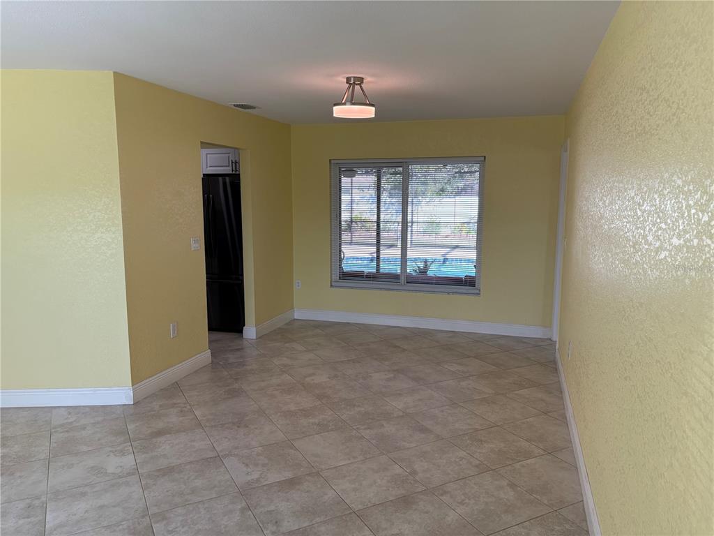 1117 Angela Maria Road Sarasota, FL 34243 - Photo 27 of 52 an empty room with windows and entrance